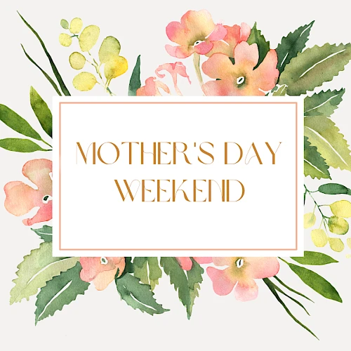 A watercolor floral card with soft pink, peach, and green blooms framing a centered white-bordered message: &ldquo;MOTHER'S DAY WEEKEND.&rdquo;